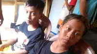 Dua bocah korban selamat usai tenggelam pantai Sodong, Cilacap. (Foto: Liputan6.com/Basarnas/Muhamad Ridlo)