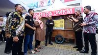 Askrindo bersama Alfamart meluncurkan program perlindungan usaha bagi 10.000 mitra UMKM di seluruh Indonesia, Senin (26/5/2025). (istimewa/Liputan6.com