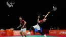Indonesia's Leo Rolly Carnando, right, and Daniel Marthin play a return against China's Liang Weikeng and Wang Chang during their men's doubles badminton final match at the Asian Games in Ichinomiya, Japan, Tuesday, Sept. 29, 2026. (AP Photo/Dita Alangkara)