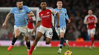 Lima menit kemudian atau pada menit ke-62, Myles Lewis-Skelly sukses menggandakan keunggulan Arsenal atas Manchester City. (Glyn KIRK/AFP)
