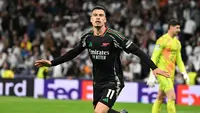 Pada masa tambahan waktu, atau menit ke-90+3, Gabriel Martinelli mencetak gol kemenangan untuk Arsenal. Skor 2-1 bertahan hingga peluit akhir dibunyikan. (JAVIER SORIANO/AFP)
