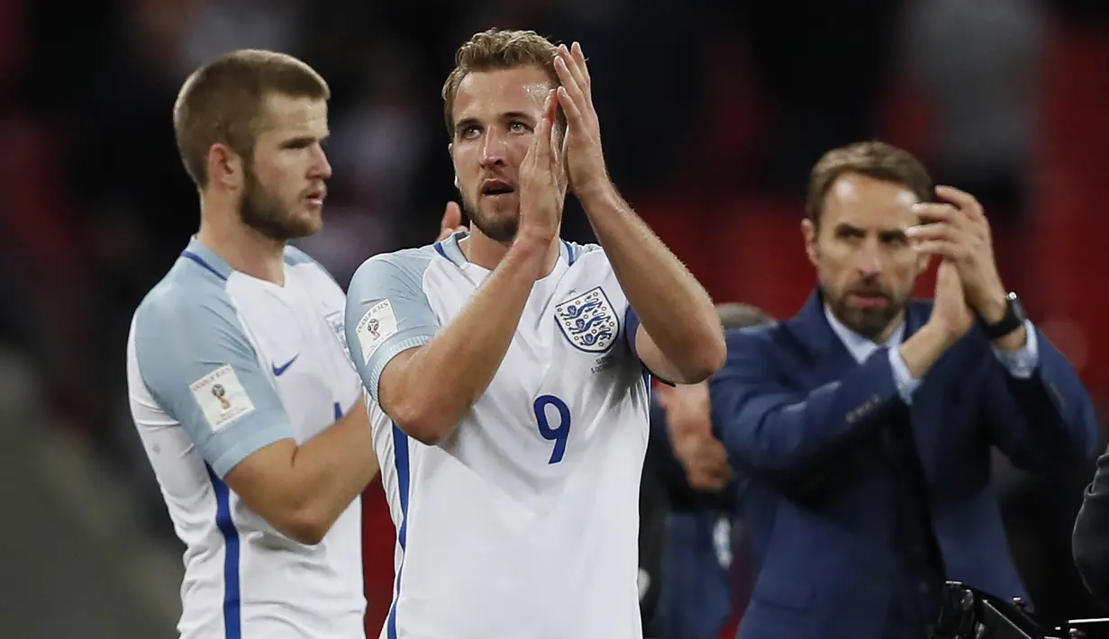 Striker Inggris, Harry Kane, melakukan selebrasi usai Inggris mengalahkan Slovenia pada laga Kualifikasi Piala Dunia 2018 di Stadion Wembley, Kamis (5/10/2017). Inggris menang 1-0 atas Slovenia. (AP/Kirsty Wigglesworth)