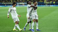 Pemain Real Madrid Kylian Mbappe (kanan) merayakan gol kedua bagi timnya bersama Vinicius Junior dan Gonzalo Garcia pada laga La Liga/Liga Spanyol antara Villarreal vs Real Madrid di Villarreal, Spanyol, Sabtu, 24 Januari 2026. (AP Photo/Alberto Saiz)