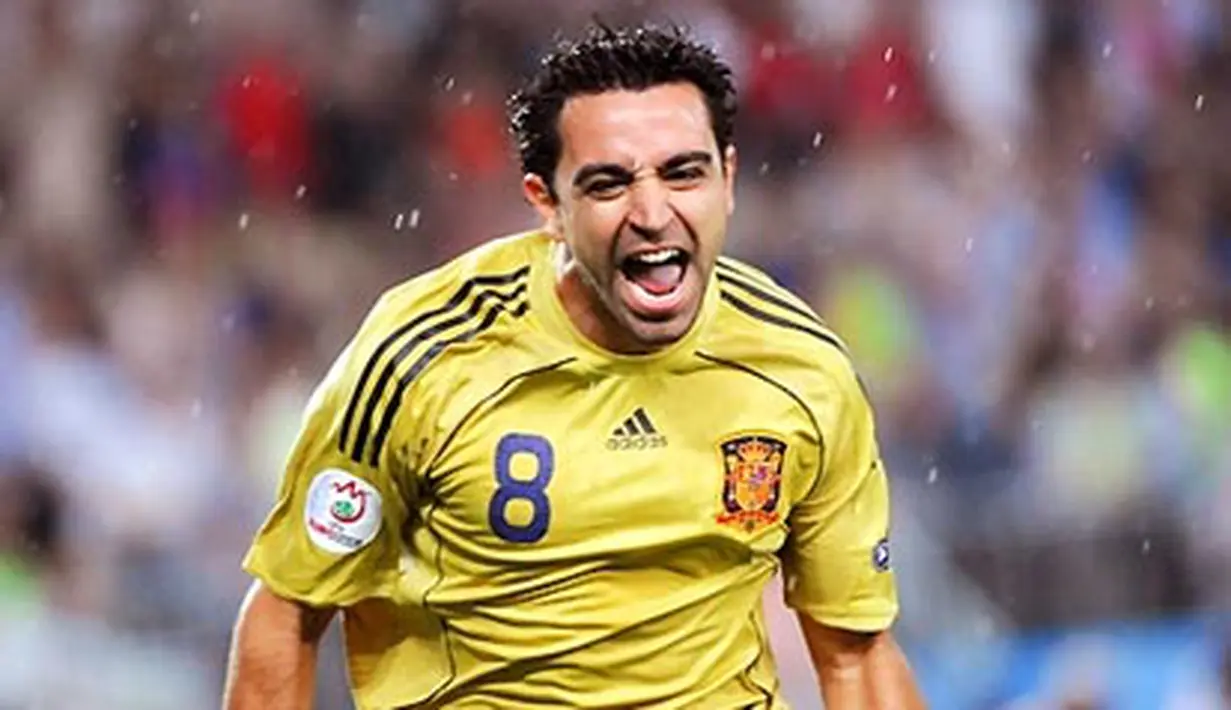 Spanish midfielder Xavi Hernandez celebrates after scoring the opening goal during the Euro 2008 championships semi-final football match Russia vs. Spain on June 26, 2008 at Ernst-Happel stadium in Vienna, Austria. AFP PHOTO / JOE KLAMAR