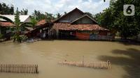 Banjir merendam rumah warga di Desa Sindangsari, Kabupaten Bekasi, Jawa Barat, Rabu (24/2/2021). Sebagian rumah warga masih terendam banjir yang disebabkan jebolnya tanggul Sungai Citarum dan luapan Sungai Ciherang. (merdeka.com/Imam Buhori)