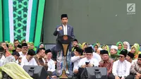 Presiden Joko Widodo atau Jokowi memberi sambutan pada Harlah ke-73 kepada Muslimat NU di Stadion Utama GBK, Jakarta, Minggu (27/1). Jokowi berharap muslimat NU makin jaya dan mendapatkan anugerah dari Tuhan. (Liputan6.com/Johan Tallo)