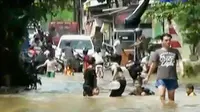 Banjir Masih Rendam Jakarta hingga Festival Payung 2016