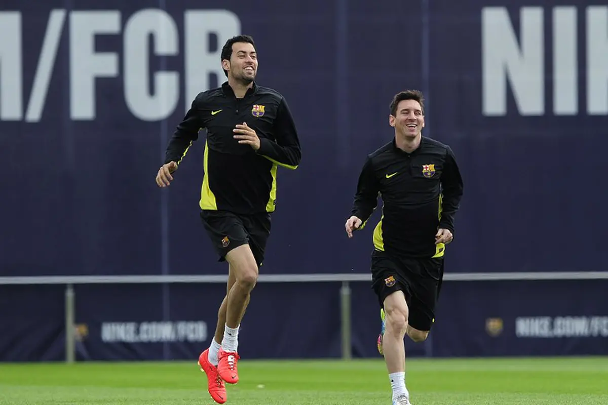 Sergio Busquets dan Lionel Messi 