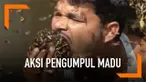 Seorang pengumpul madu asal India melakukan aksi menegangkan. Ia memasukkan lebah ke mulutnya.