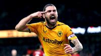 Pemain Wolverhampton Wanderers Ruben Neves melakukan selebrasi usai mencetak gol ke gawang Liverpool pada pertandingan sepak bola Liga Inggris di Stadion Molineux, Wolverhampton, Inggris, 4 Februari 2023. Wolverhampton Wanderers mengalahkan Liverpool dengan skor 3-0. (Barrington Coombs/PA via AP)