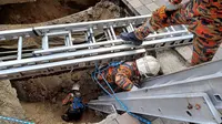 Sinkhole di Jalan Masjid India, Kuala Lumpur, Malaysia. (AP/ Vincebt Thian)