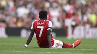 Bukayo Saka mengalami cedera dalam laga Arsenal vs Leeds United di Premier League 2025/2026, Sabtu (23/8/2025). (AP Photo/Ian Walton)