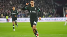 Pemain Liverpool, Trent Alexander-Arnold, merayakan gol keempat timnya dalam pertandingan Liga Primer Inggris antara West Ham United dan Liverpool di Stadion London, London, Senin dini hari WIB (30-12-2024). (Foto AP/Kirsty Wigglesworth)