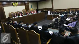 Sidang tujuh terdakwa di pengadilan Tipikor, Jakarta,  Rabu (26/10). Tujuh legislator itu adalah Muhammad Afan, Budiman Nadapdap, Guntur Manurung, Zulkifli Effendi Siregar, Bustami, Parluhutan Siregar serta ZulkifliHusein. (Liputan6.com/Helmi Affandi)