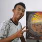 Hendro Prasetyo, pemuda Tuli asal Nganjuk, Jawa Timur yang gemar melukis. Foto: Tangkapan layar Instagram hendro_prasetyo_24.