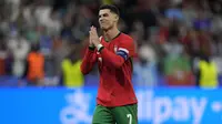 Reaksi Cristiano Ronaldo usai mencetak gol ke gawang Slovenia saat adu penalti pada 16 besar Euro 2024, Selasa (2/7/2024) dini hari WIB. (AP Photo/Ariel Schalit