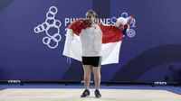 Putri Andriani, atlet angkat besi menyumbang medali perunggu di kelas 59 kg putri SEA Games 2019. (Bola.com/Zulfirdaus Harahap)