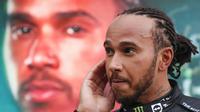 Ekspresi pembalap Mercedes, Lewis Hamilton, setelah memenangi balapan F1 GP Rusia, di Sirkuit Sochi, Minggu (26/9/2021). (Yuri Kochetkov/AFP)