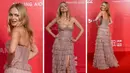 Foto kombinasi saat Heather Graham berpose untuk fotografer setibanya di amfAR, yayasan penelitian bantuan, makan malam, selama Venice Film Festival 2022 ke-79 di Venesia, Italia, Rabu, 7 September 2022. (AP Photo/Domenico Stinellis )