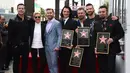 Personel boyband NSYNC saat dianugrahi Hollywood Walk of Fame di Los Angeles (30/4). Mereka dianugrahi bintang Hollywood Walk of Fame atas kiprahnya di bidang musik. (Jordan Strauss / Invision / AP)