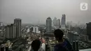 "Konsentrasi PM 2,5 di Jakarta saat ini 20,3 kali nilai panduan kualitas udara tahunan WHO," tulis situs IQAir per pukul 14.09 WIB.  (Liputan6.com/Faizal Fanani)