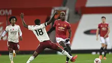 Gelandang Manchester United (MU) Paul Pogba coba diadang pemain Arsenal Thomas Partey dalam laga Liga Inggris di Old Trafford, Minggu (1/11/2020). (Shaun Botterill / Pool via AP )