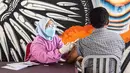 Warga menerima vaksinasi COVID-19 Sinovac di Terowongan Kendal, Jakarta Pusat, Jumat (30/7/2021). Berdasarkan data Kemenkes per 29 Juli 2021 Pukul 18.00, total masyarakat yang menerima dosis satu vaksin sebanyak 46.567.370, dosis kedua sebanyak 19.867.271 orang. (Liputan6.com/Faizal Fanani)