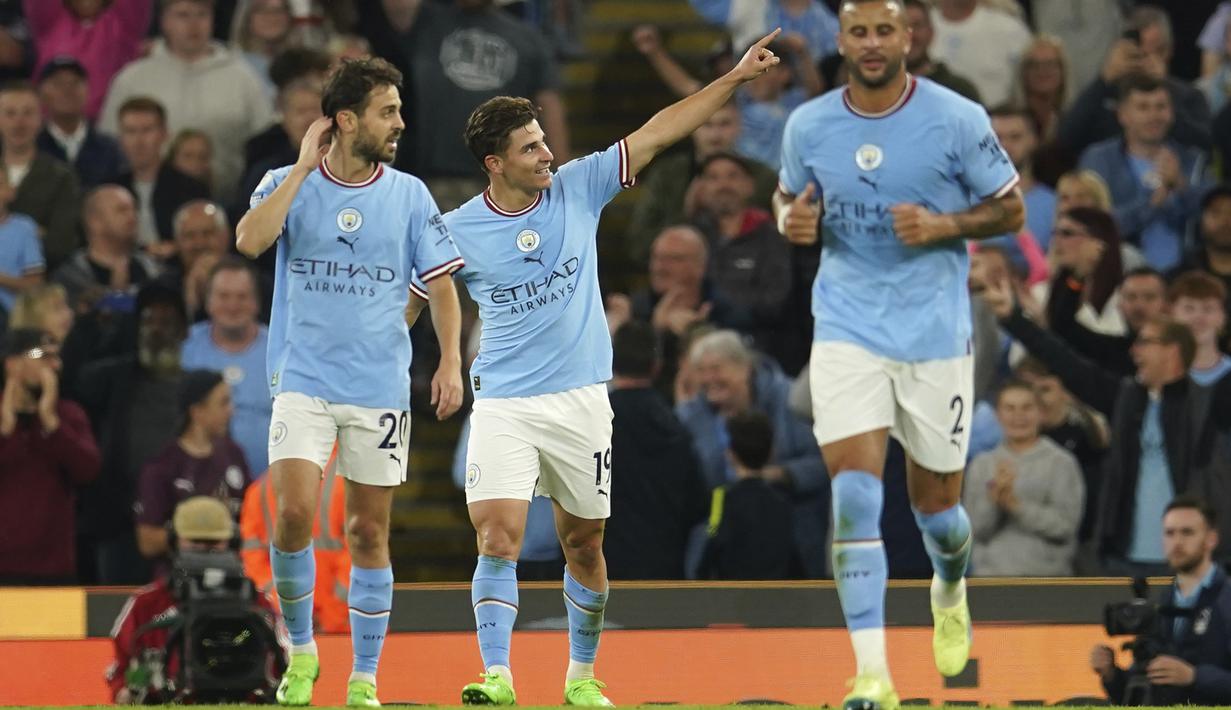 <p>Penyerang Manchester City, Julian Alvarez berselebrasi usai mencetak gol ke gawang Nottingham Forest pada pertandingan lanjutan Liga Inggris di Stadion Etihad di Manchester, Inggris, Kamis (1/9/2022). Alvarez mencetak dua gol dan mengantar Manchester City menang besar atas Nottingham Forest 6-0. (AP Photo/Dave Thompson)</p>