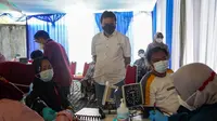 Peruri bekerja sama dengan Puskesmas Telukjambe menggelar program vaksinasi gratis (Dok: Peruri)