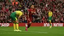 Grant Hanley. Bek Skotlandia berusia 30 tahun yang telah memperkuat Norwich City sejak awal musim 2017/2018 ini menjadi pencetak gol pembuka di Liga Inggris musim 2020/2021 saat Norwich dibungkam tuan rumah Liverpool 1-4 (10/8/2019). Ia menjadi penyebab gol pertama Arsenal melalui gol bunuh diri dalam laga tersebut pada menit ke-7. Tiga gol Liverpool lainnya dicetak oleh Mohamed Salah, Virgil van Dijk dan Divock Origi pada menit ke-19, 28 dan 42. Sementara satu-satunya gol Norwich ke gawang The Reds dicetak Teemu Pukki pada menit ke-64. (AFP/Oli Scarff)