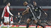 Pemain Manchester United, Antonio Valencia merayakan gol cepatnya ke gawang Arsenal pada lanjutan Premier League di Emirates Stadium, London, (2/12/2017). MU kandaskan Arsenal 3-1. (AFP/Adrian Dennis)