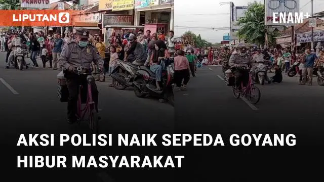 Aksi seorang anggota Polisi mencoba naik sepeda goyang menarik perhatian