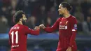 Penyerang Liverpool, Mohamed Salah bersama Virgil van Dijk merayakan gol ke gawang KRC Genk pada laga Liga Champions 2019 di KRC Genk Arena, Rabu (23/10). Liverpool menang 4-1 atas KRC Genk. (AP/Francisco Seco)