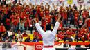 Ahmad Zigi Zaresta mengangkat tangan usai menang di final Junior Kata Male di WKF World Junior, Cadet and U-21 Championship 2015 di ICE Serpong, Banten, Kamis (12/11/2015). Zigi menyumbang emas pertama bagi Indonesia. (Liputan6.com/Helmi Fithriansyah)