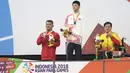 Ekspresi Aris perenang Indonesia yang berhasil meraih medali perak di nomor 100 meter gaya dada klasifikasi SB7 pada Asian Para Games 2018, Gelora Bung Karno Jakarta, Senin (8/10/2018).  (Bola.com/Peksi Cahyo)