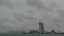 Awan tebal memenuhi langit di atas menara Burj Al-Arab di Dubai, Uni Emirat Arab, pada tanggal 2 Mei 2024. (Giuseppe CACACE/AFP)