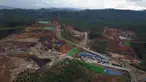 Foto udara yang diambil dengan menggunakan drone menunjukkan lokasi pembangunan ibu kota baru di Penajam Paser Utara, Kalimantan Timur, Indonesia, Rabu 8 Maret 2023. Indonesia memulai pembangunan ibu kota baru pada pertengahan 2022, setelah Presiden Joko Widodo mengumumkan bahwa Jakarta—ibu kota saat ini—sudah semakin padat, berpolusi, rawan gempa bumi, dan dengan cepat tenggelam ke dalam Laut Jawa. (AP Photo/Achmad Ibrahim)