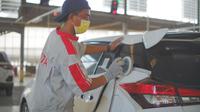 Proses perbaikan mobil di bengkel repair body & cat Auto2000 (Amal/Liputan6.com)