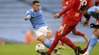 Phil Foden dari Manchester City mencetak gol ketiga pada putaran ketiga Piala FA Inggris di Stadion Etihad di Manchester, Inggris, Minggu 10 Januari 2021. (Mike Egerton // PA melalui AP)