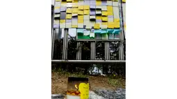 Sebuah lilin terlihat terus menyala di depan gerbang utama Ansan Danwon High School, Korea Selatan, Senin (21/4/2014) dalam peringatan mengenang tenggelamnya kapal feri Sewol. (AFP PHOTO/KIM DOO-HO)