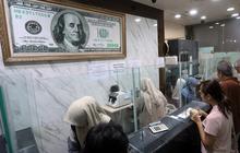 FOTO: BI Akan Memperketat Pembelian Dolar AS di Tengah Tekanan Rupiah