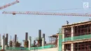 Pekerja menyelesaikan pembangunan gedung bertingkat di Jakarta, Senin (7/5). Badan Pusat Statistik (BPS) melansir pertumbuhan ekonomi kuartal 1 2018 mencapai 5,06%.(Liputan6.com/Immanuel Antonius)