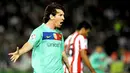Striker bntang Barcelona Lionel Messi menciptakan hat-trick ke gawang Almeria yang dilumat 8-0 pada partai La Liga di Estadio del Mediterraneo, 20 November 2010. AFP PHOTO/JORGE GUERRERO