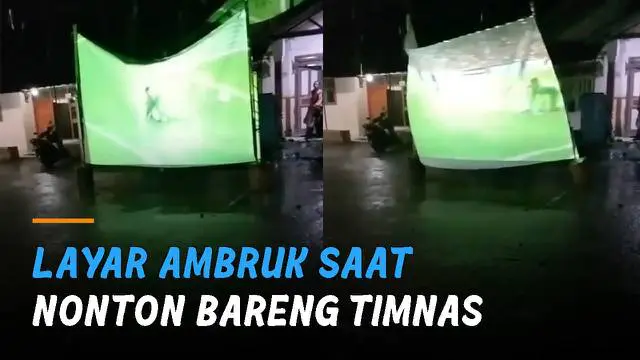 Layar yang dipakai untuk latar proyektor rubuh usai diterpa angin kencang.