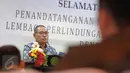 Ketua LPSK Abdul Haris memberi sambutan pada penandatanganan MoU dengan Kejagung RI di Jakarta, Selasa (19/4). Kejagung dan LPSK memperpanjang nota kesepakatan dalam hal perlindungan saksi menyusul habisnya masa MoU terdahulu. (Liputan6.com/Helmi Afandi)