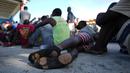 Imigran Haiti menunggu untuk diproses dan menerima perawatan medis di sebuah perkemahan wisata di Sierra Morena, di provinsi Villa Clara, Kuba (25/5/2022). (AP Photo/Ramon Espinosa)