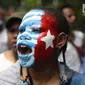 Mahasiswa Papua yang tergabung dalam Aliansi Mahasiswa Anti Rasisme, Kapitalisme, Kolonialisme, dan Militerisme berunjuk rasa di depan Istana Merdeka, Jakarta, Rabu (28/8/2019). Mereka menuntut diberikan hak untuk menentukan nasib sendiri melalui referendum. (Liputan6.com/Angga Yuniar)