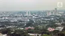 Pemandangan gedung bertingkat dan permukiman warga di antara perpohonan Jakarta, Kamis (13/2/2020). Wahana Lingkungan Hidup (Walhi) menyebut Ruang Terbuka Hijau (RTH) di Jakarta tidak cukup untuk menggerus polusi udara. (Liputan6.com/Faizal Fanani)