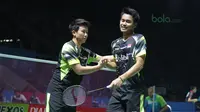 Tontowi Ahmad/Liliyana Natsir merayakan kemenangan atas pasangan Malaysia, Tan Kian/Lai Peng pada babak pertama Indonesia Open 2018 di Istora Senayan, Jakarta, (3/6/2018). Tontowi/Liliyana menang 21-11 21-14.  (Bola.com/Nick Hanoatubun)