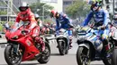 Pembalap MotoGP melakukan parade jelang MotoGP Mandalika 2022, di kawasan Bundaran HI, Jakarta, Rabu (16/3/2022). Parade dimulai dari Istana Negara yang dilepas langsung oleh Presiden Republik Indonesia, Joko Widodo. (Liputan6.com/Herman Zakharia)